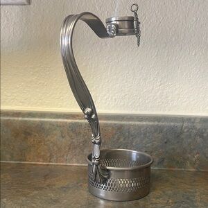 Ornate silver-plated Louis XVI style wine bottle holder.